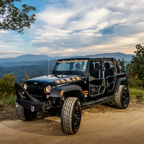 jeep in front of mountains