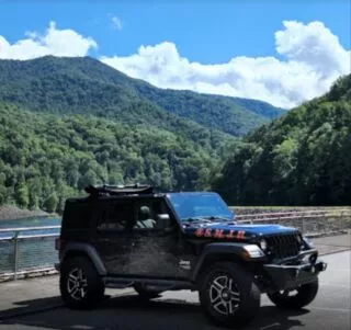 jeep in front of mountains